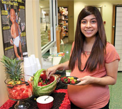 pregnant woman eating fruit