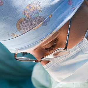 Up Close of Surgeon Looking Through Glasses